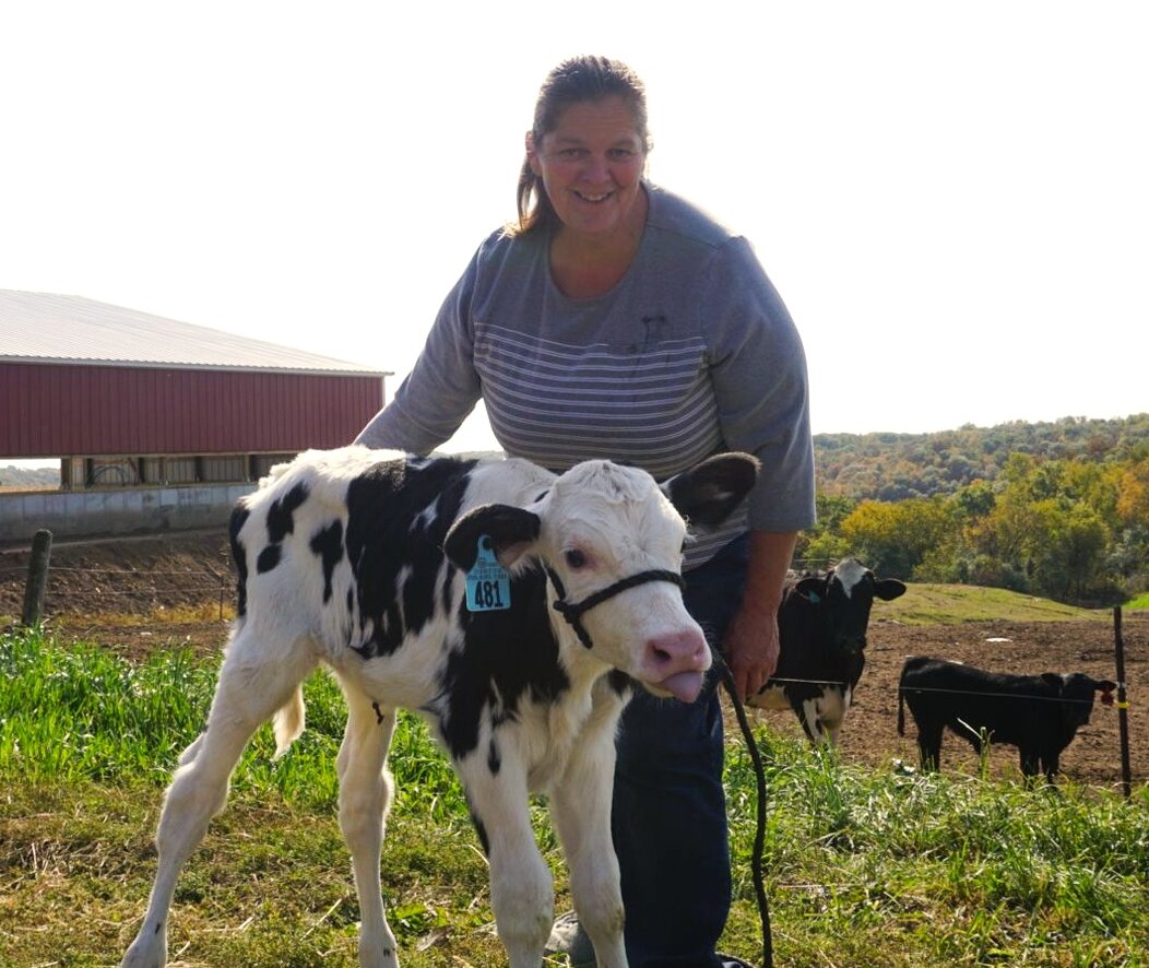 Renee posing with one of her cows